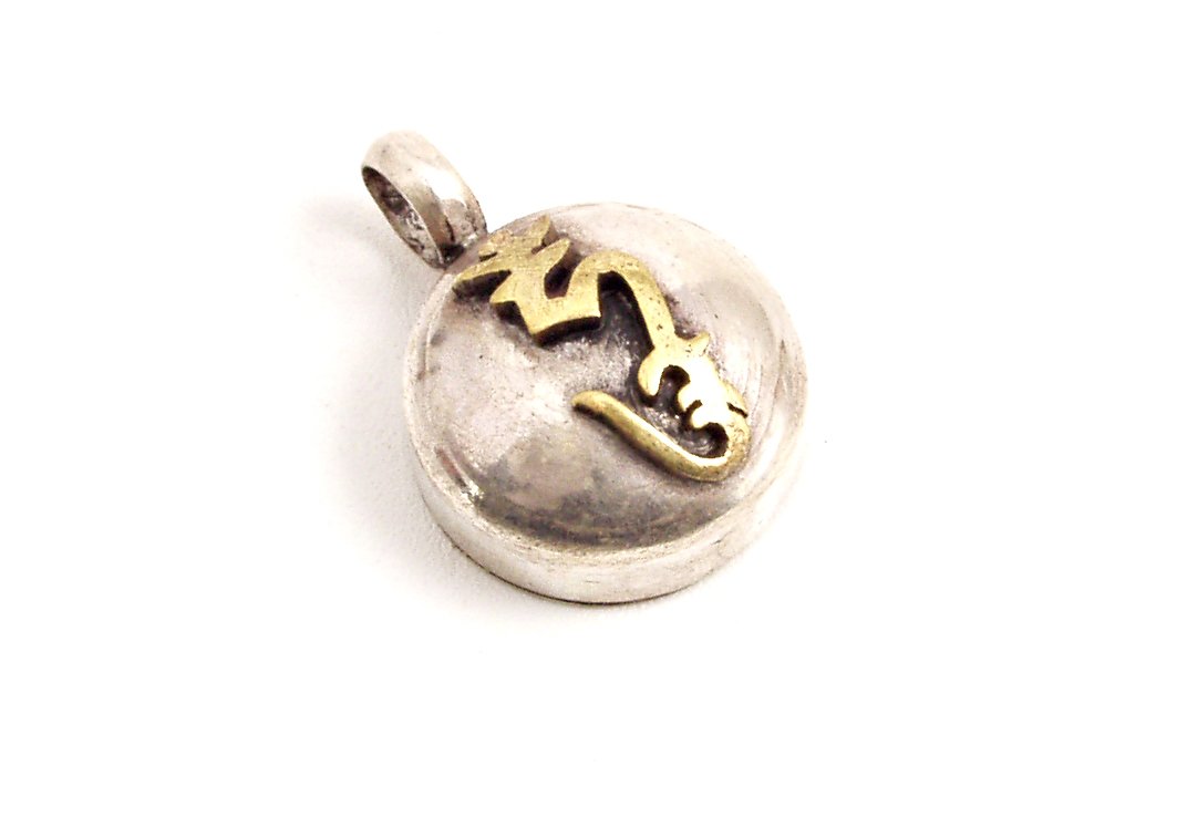 a silver and gold locke pendant