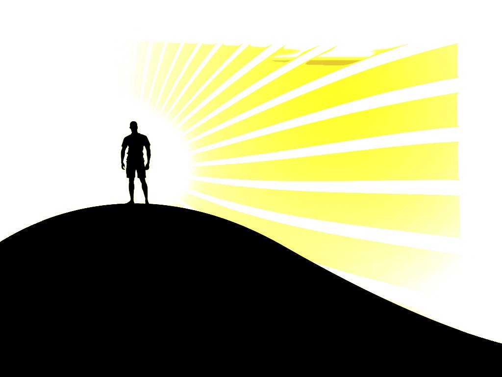 a person standing in the sun over a hill