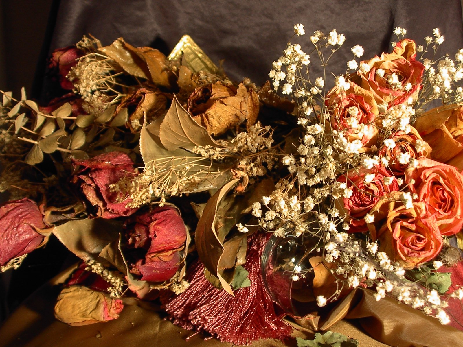 a lot of flowers in the vase on the table