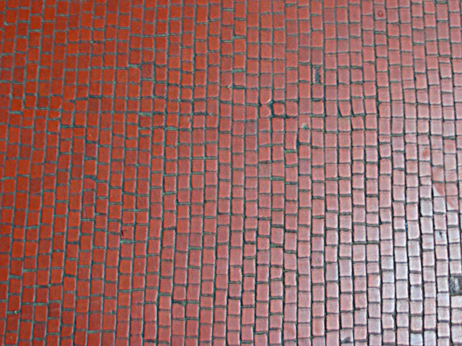 an image of a red and black tile floor