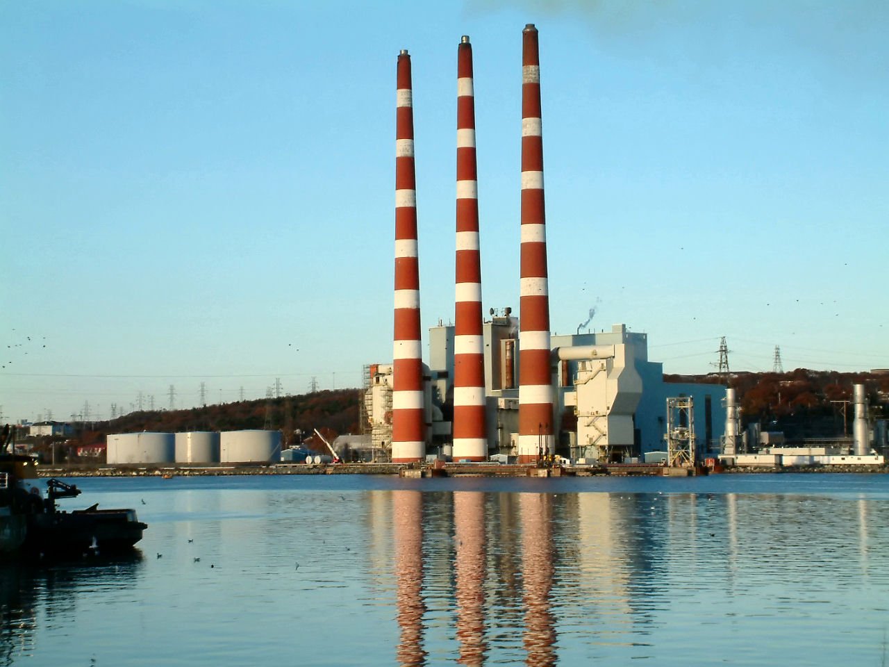 a large building with two stacks of smoke