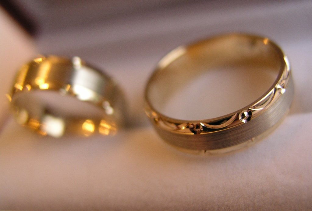 two rings sitting on a surface next to each other