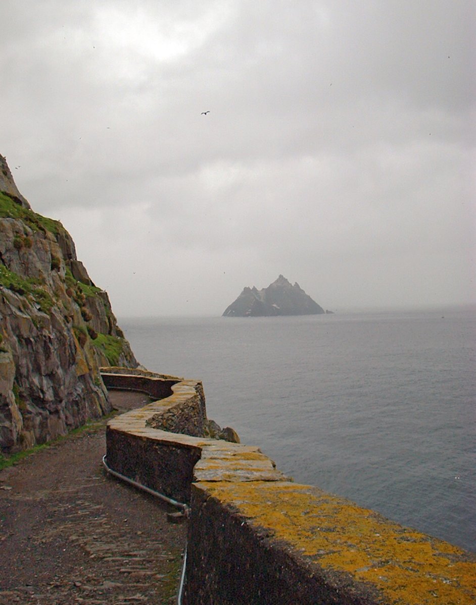 this is an image of an island and rocks by the ocean