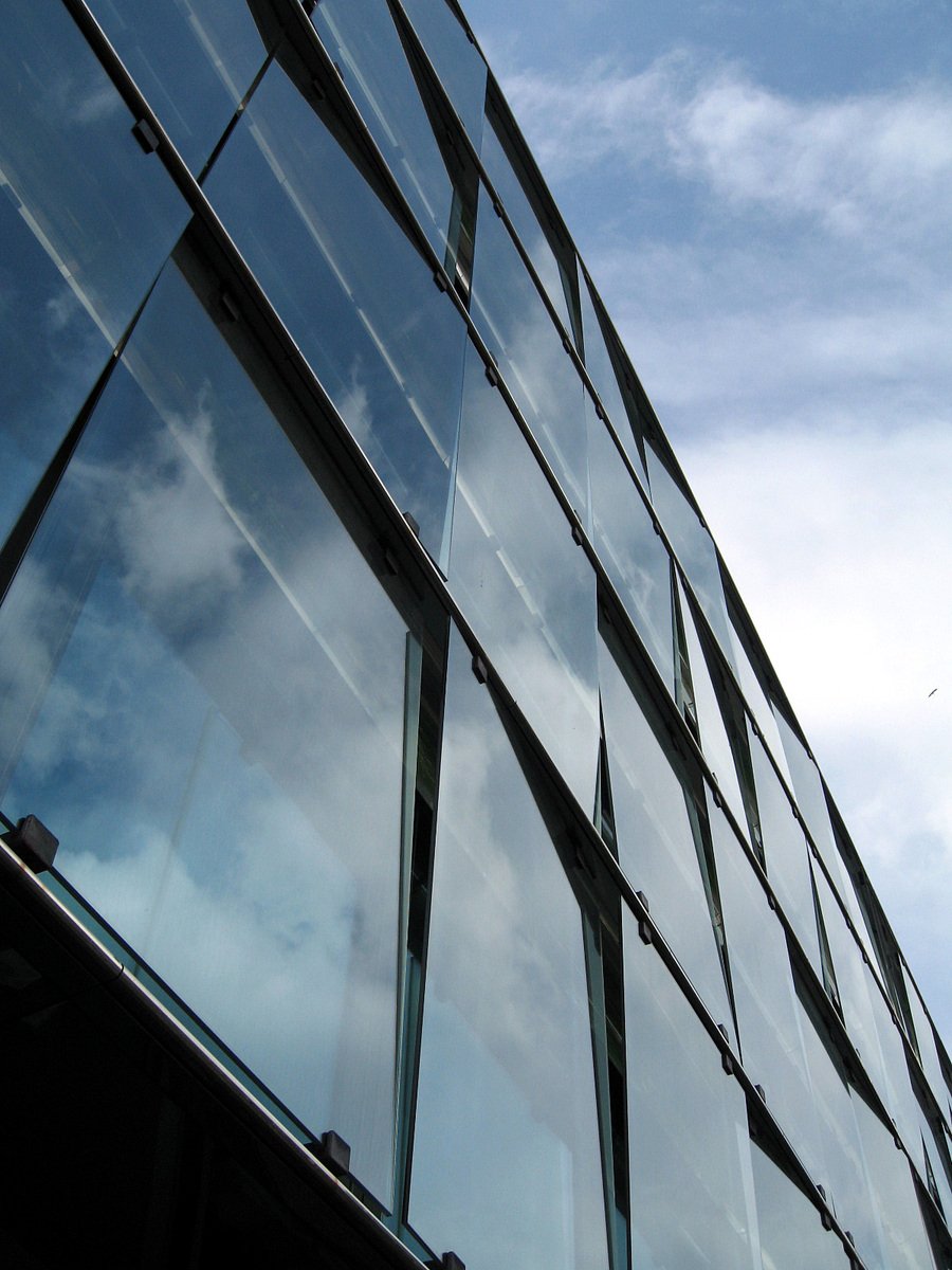 a view of a glass building through the window