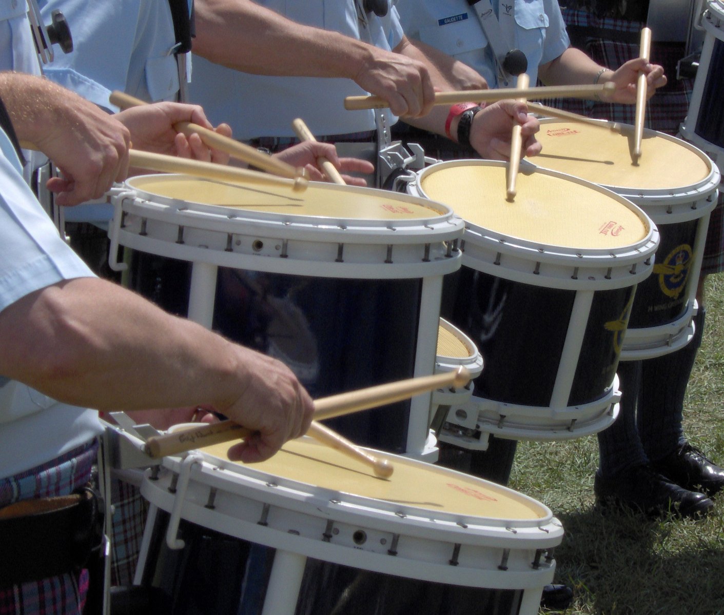 drums being played by police and other uniformed officers