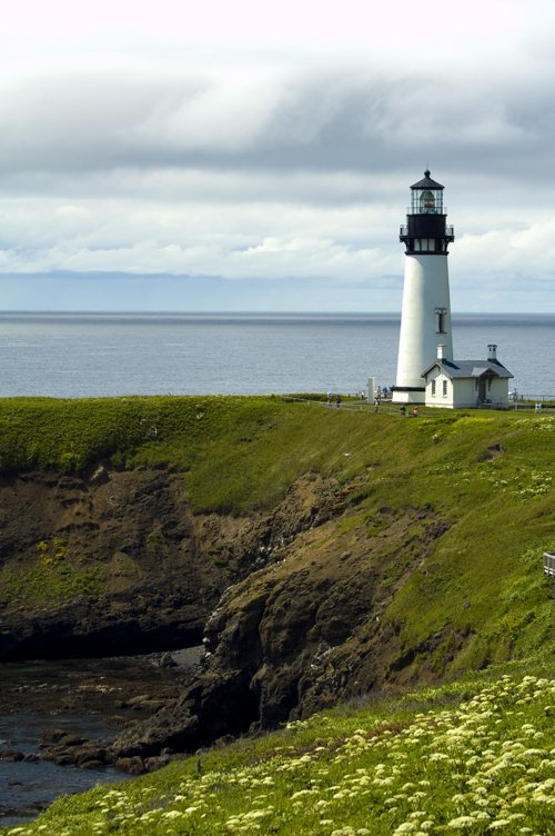 lighthouse perched on top of a rocky cliff