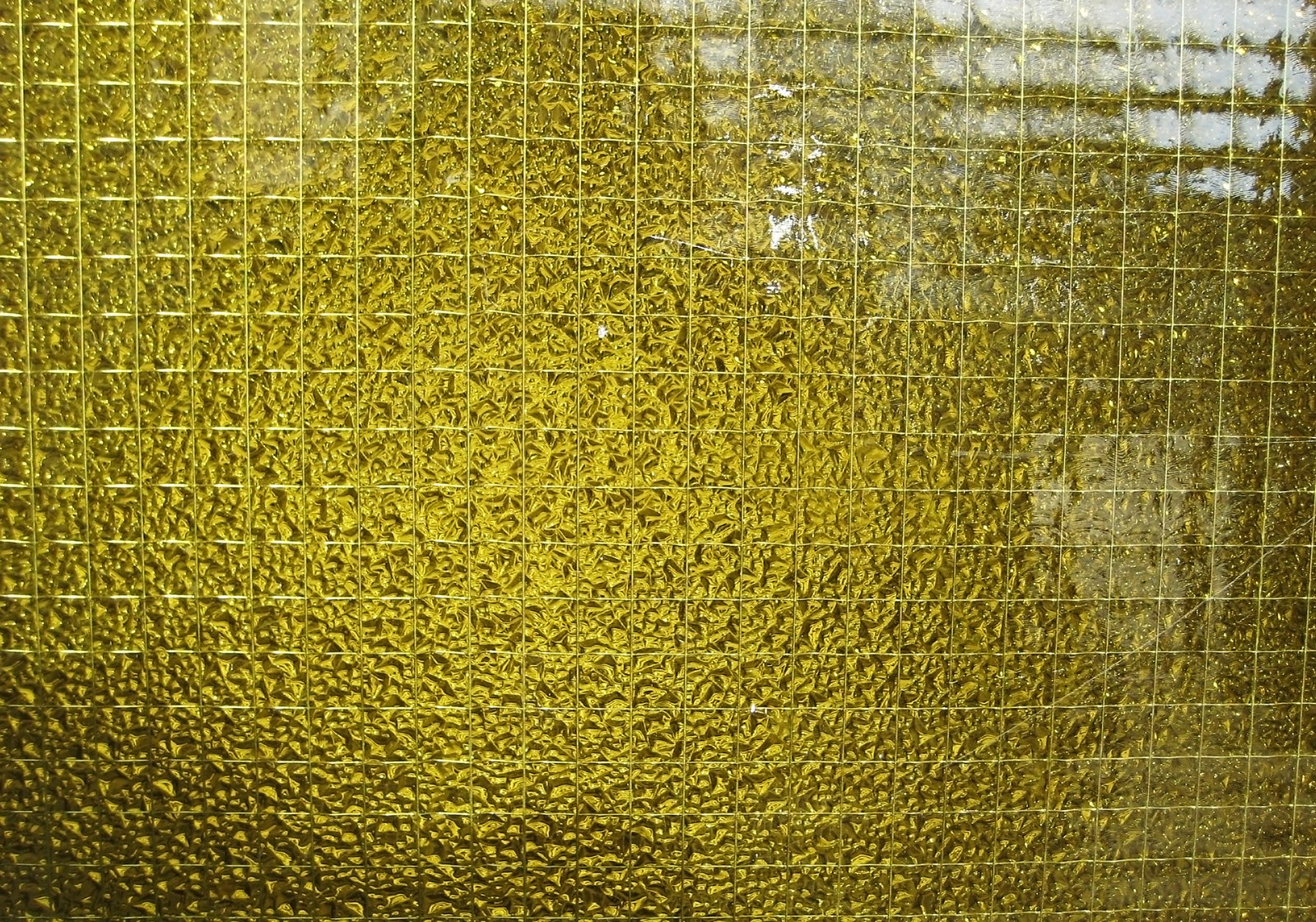 a piece of glass that is yellow with no squares