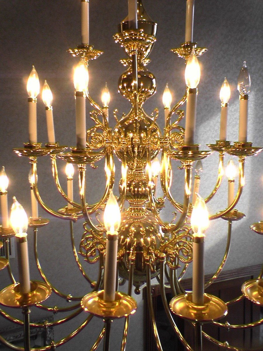 an ornate chandelier with lit candles inside of it