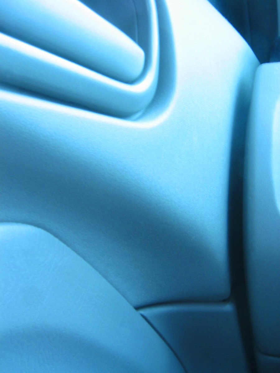 the inside of a car's seat is shown in light blue