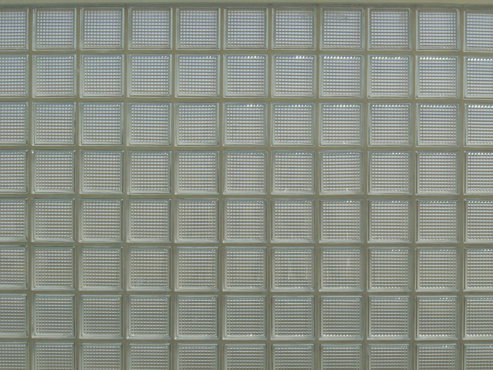 white square grid wall with no tiles or holes