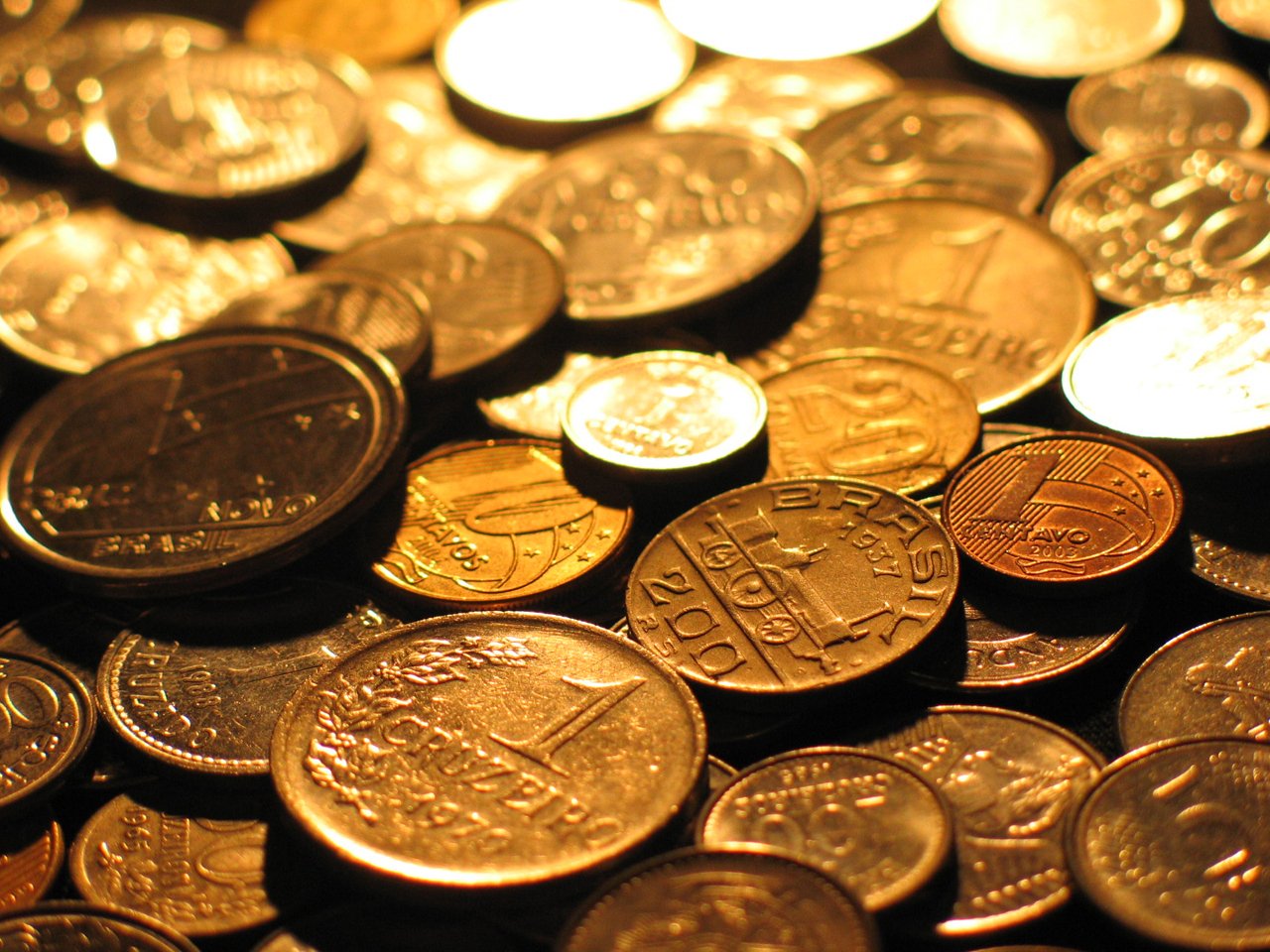 a pile of coins are shown in gold