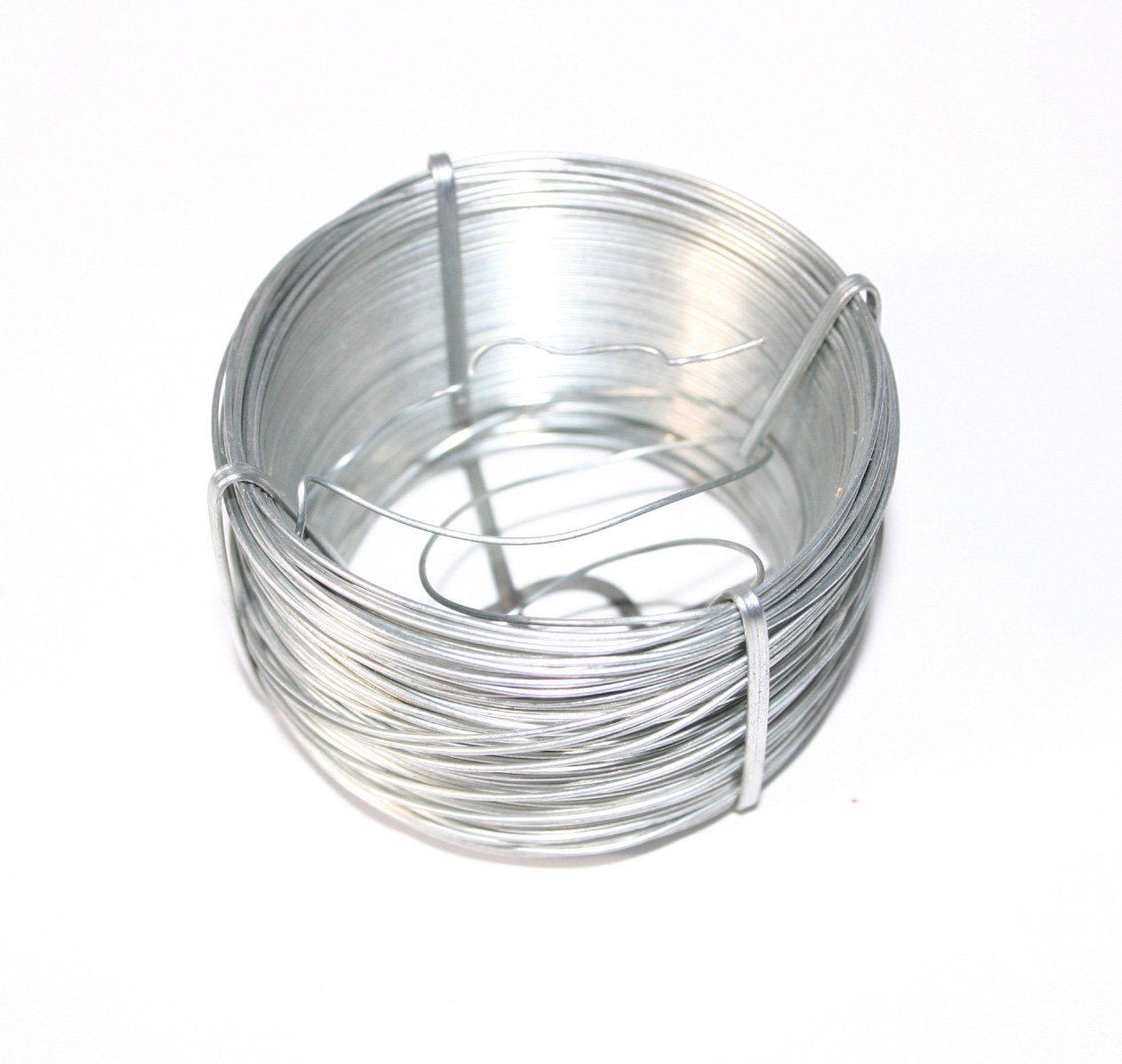 the coil of wire is wrapped around the wire on a white surface