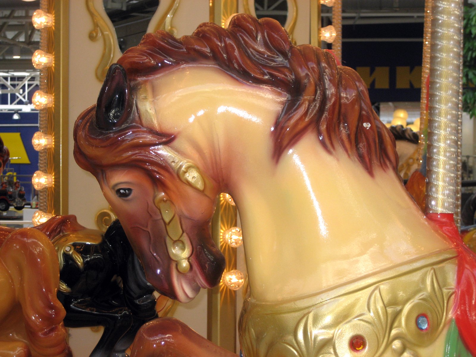 a statue of a horse with horns around its neck