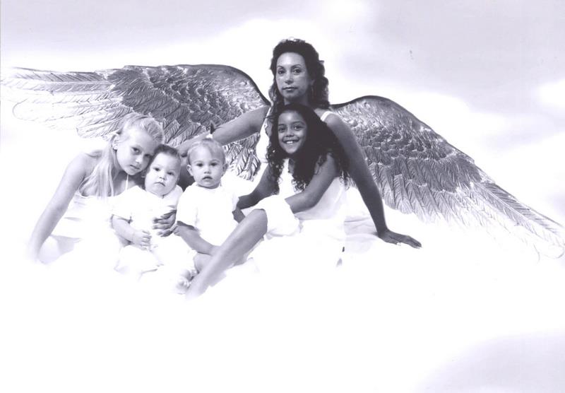 several women and a baby with wings in black and white