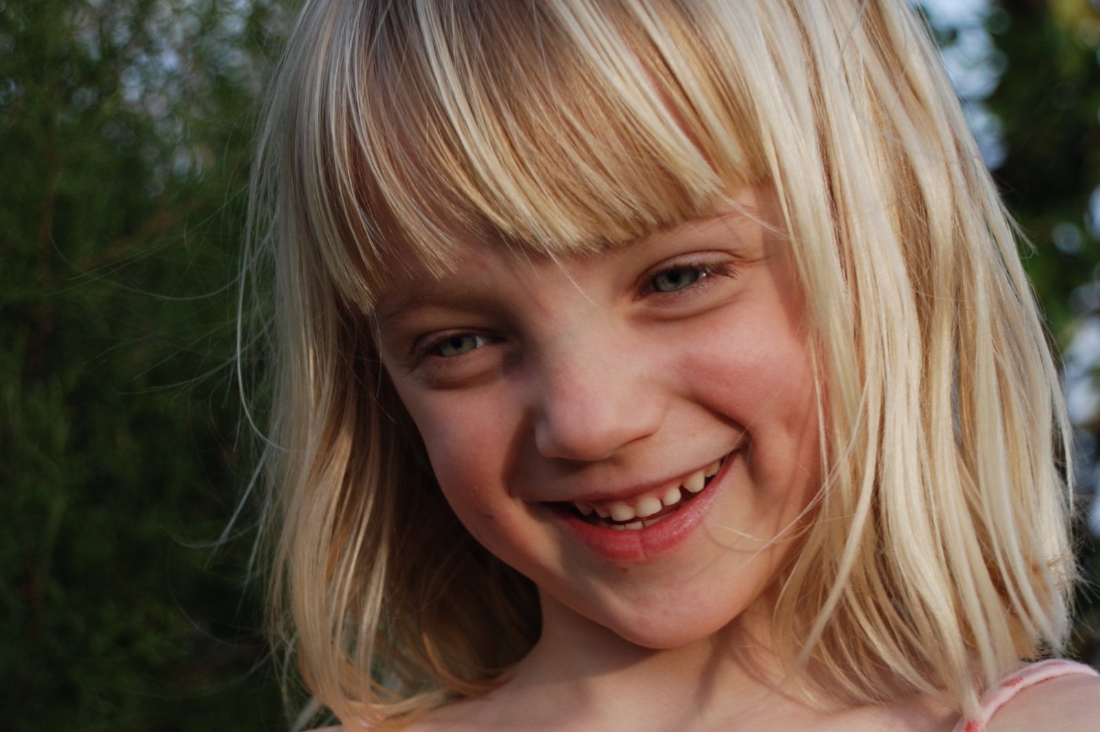 little girl with blond hair and a short dress