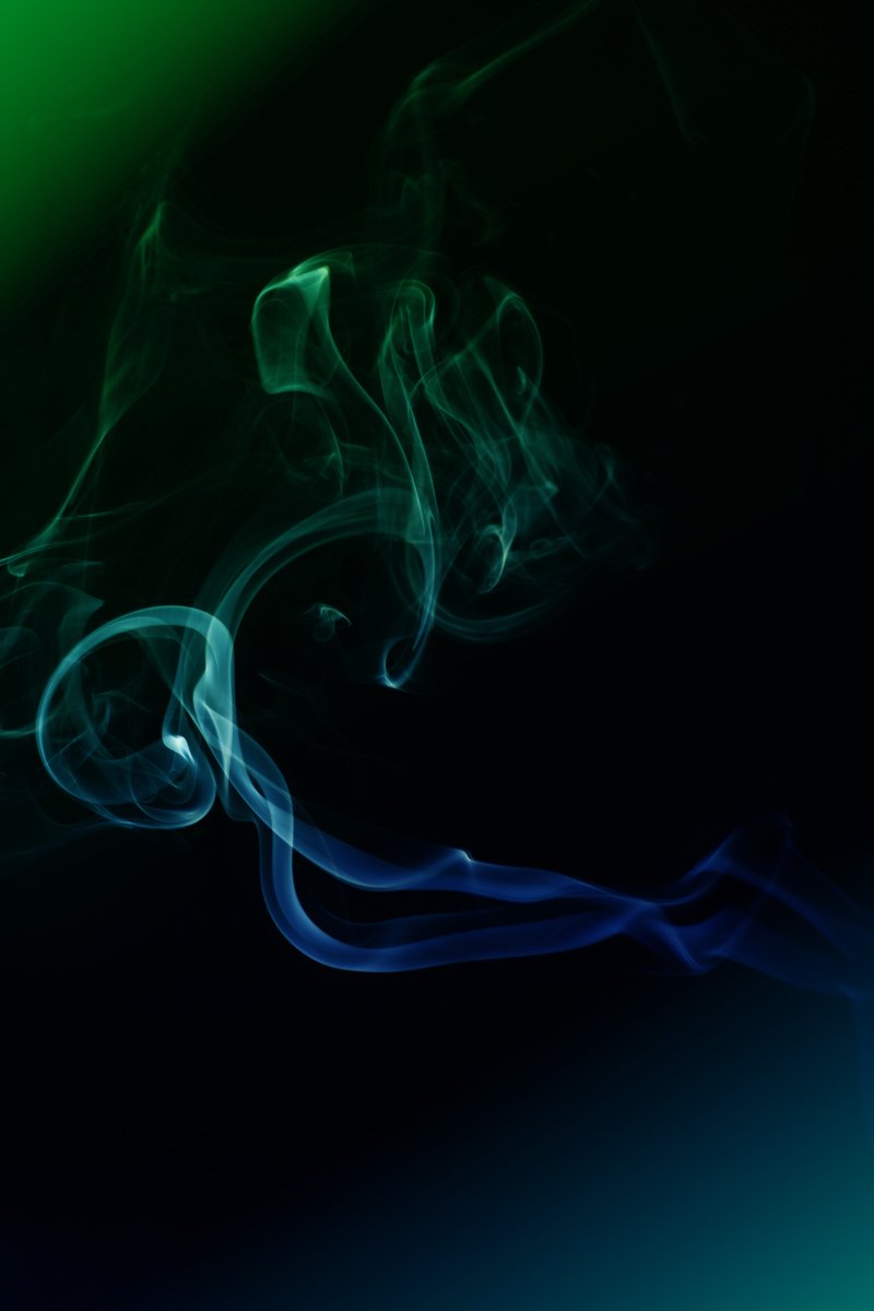 a green smoke is coming from the side of the camera