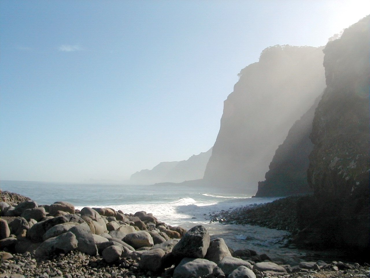 rocky coastline with light haze in background