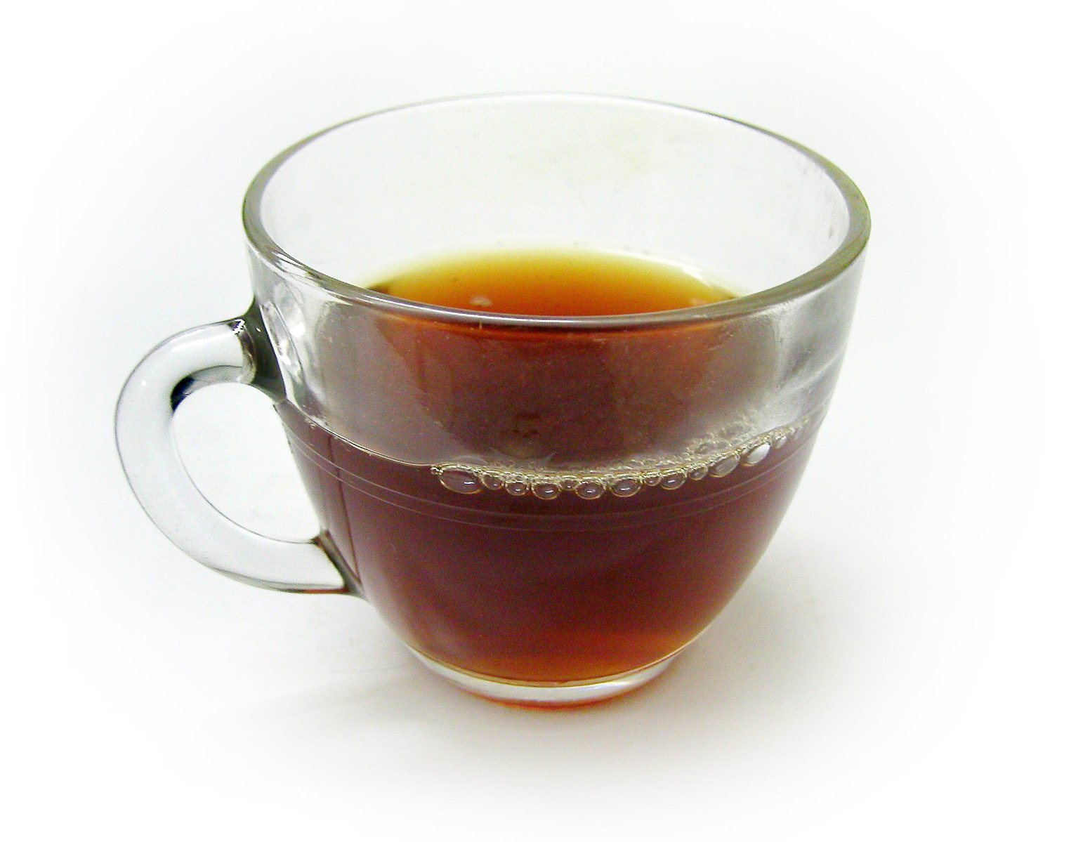 a coffee mug is filled with liquid on the table