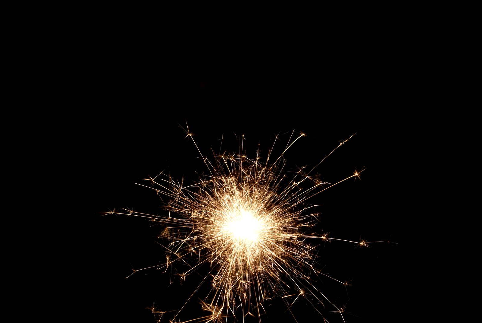 sparkler in the sky during night time with black background