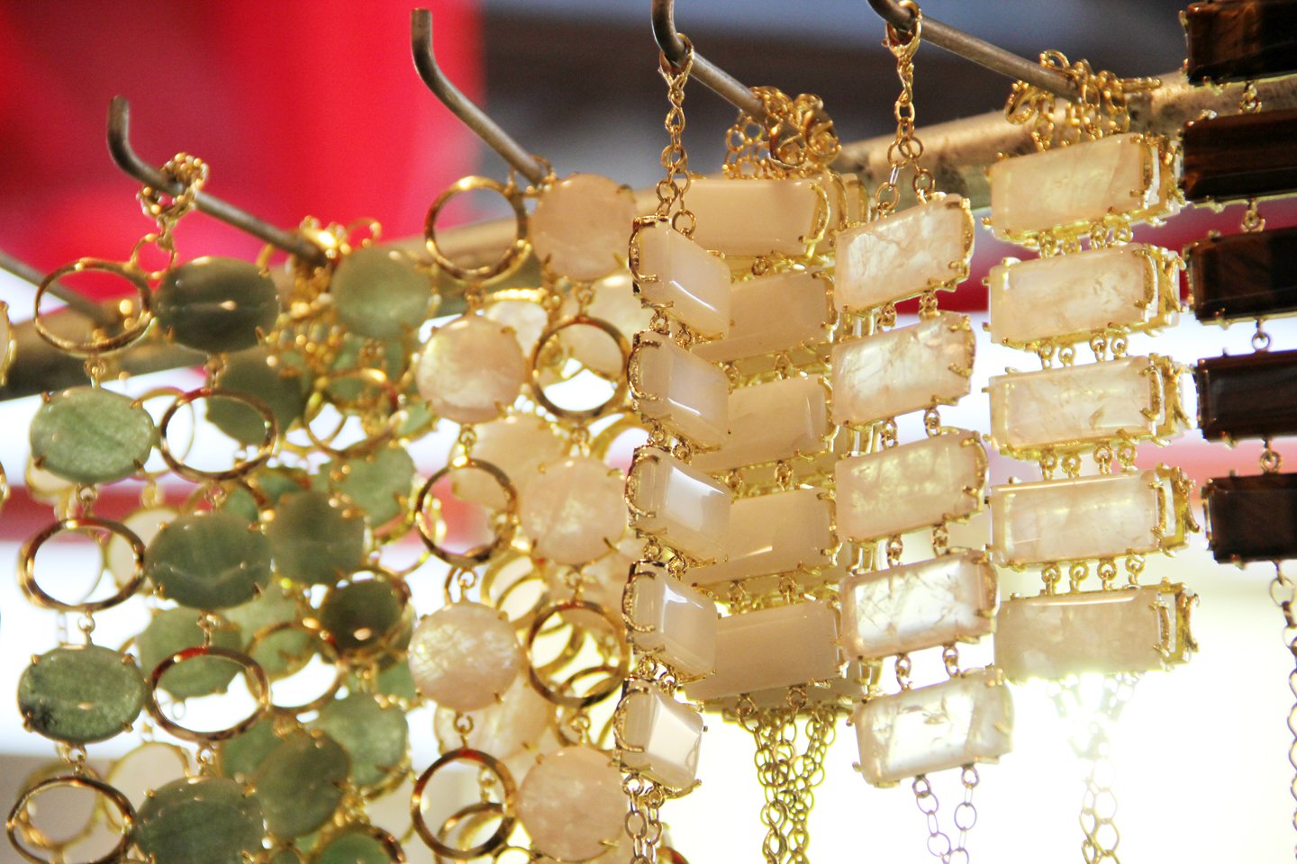 necklaces hanging and gold chains at an jewelry shop