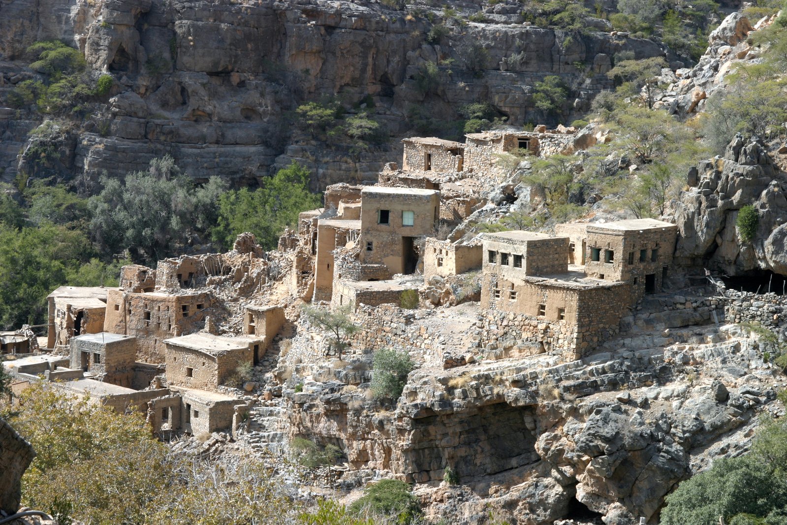 a large group of buildings sitting on top of a cliff side