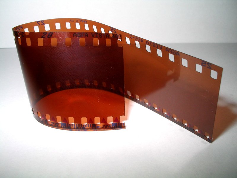 a roll of brown film sitting on a white surface