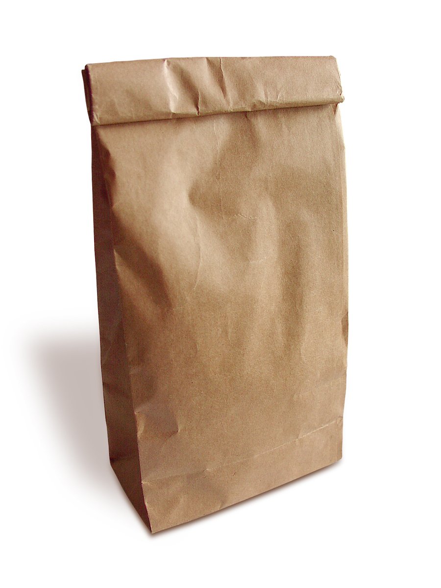 a brown paper bag sitting on a white surface