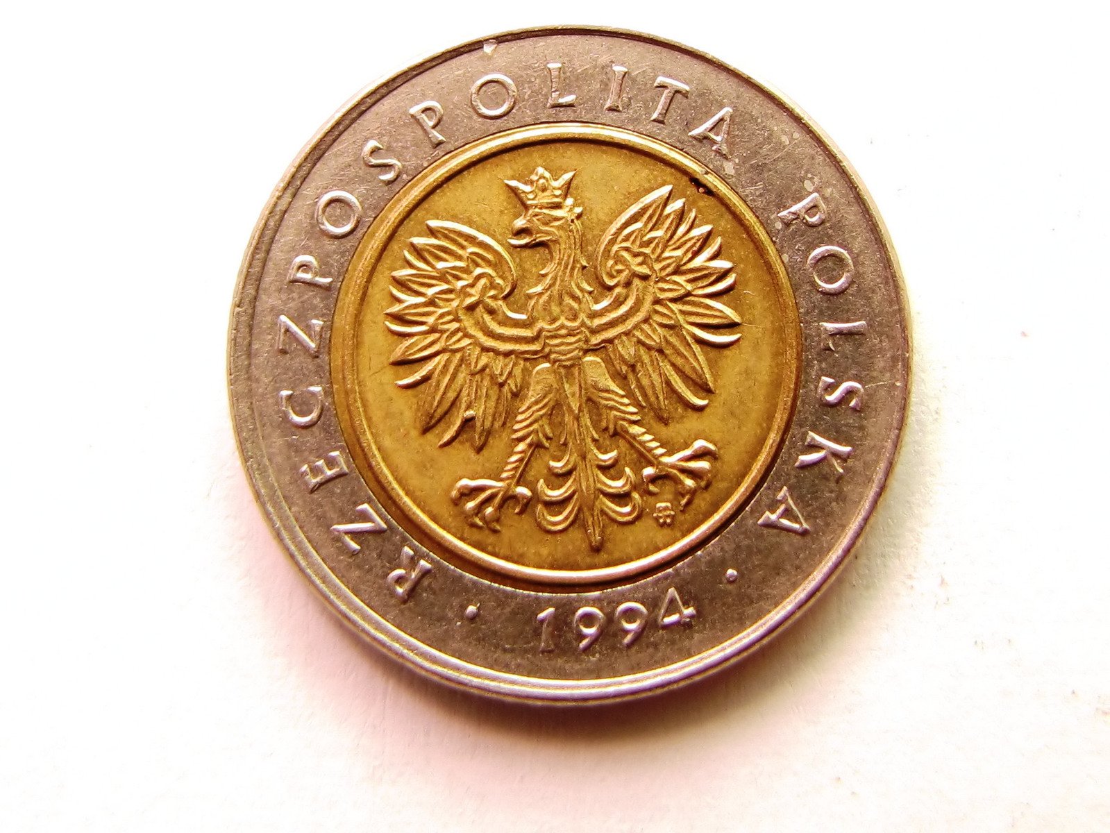 a foreign coin, with the head of an eagle