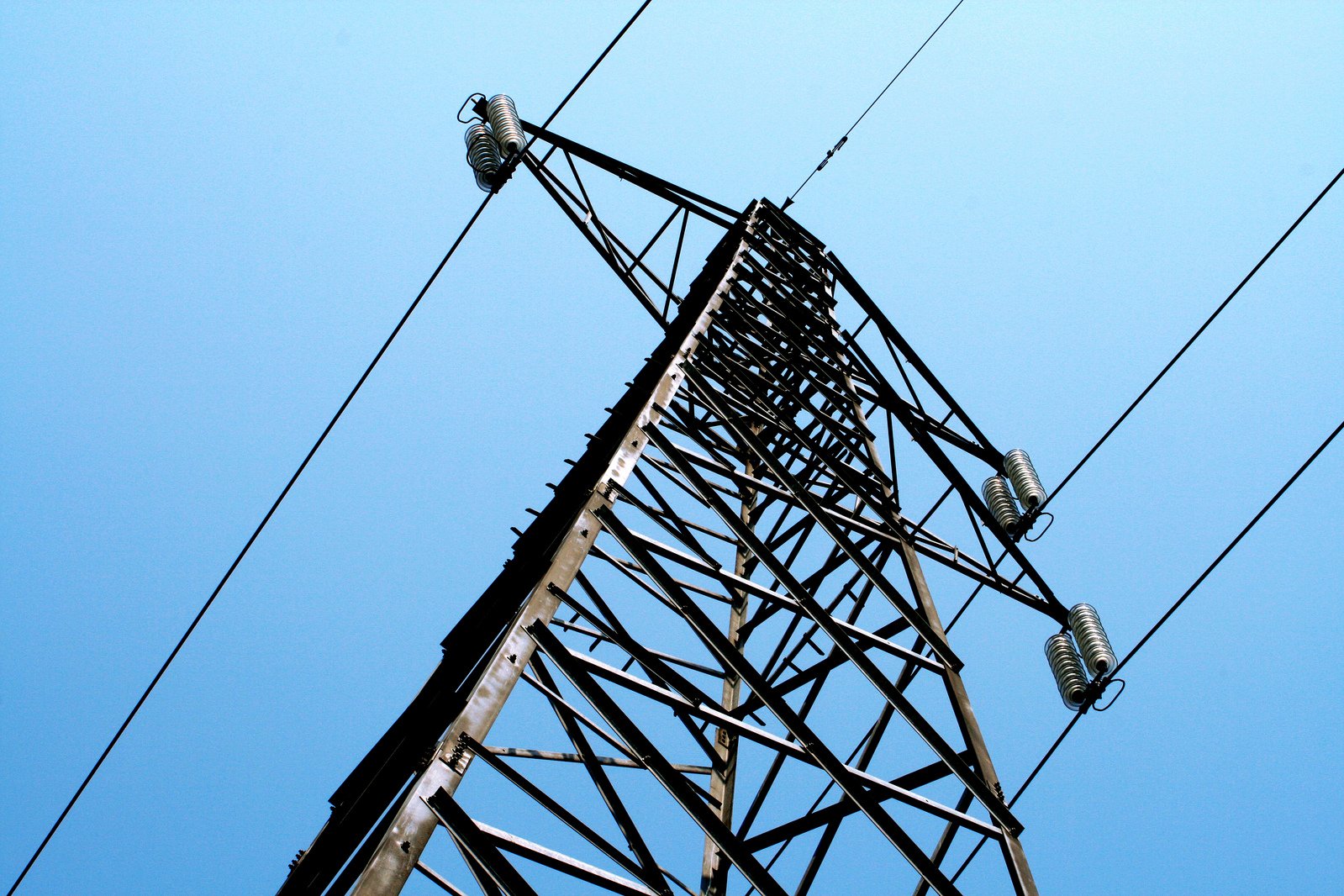 a tall metal tower with a bunch of wires attached to it