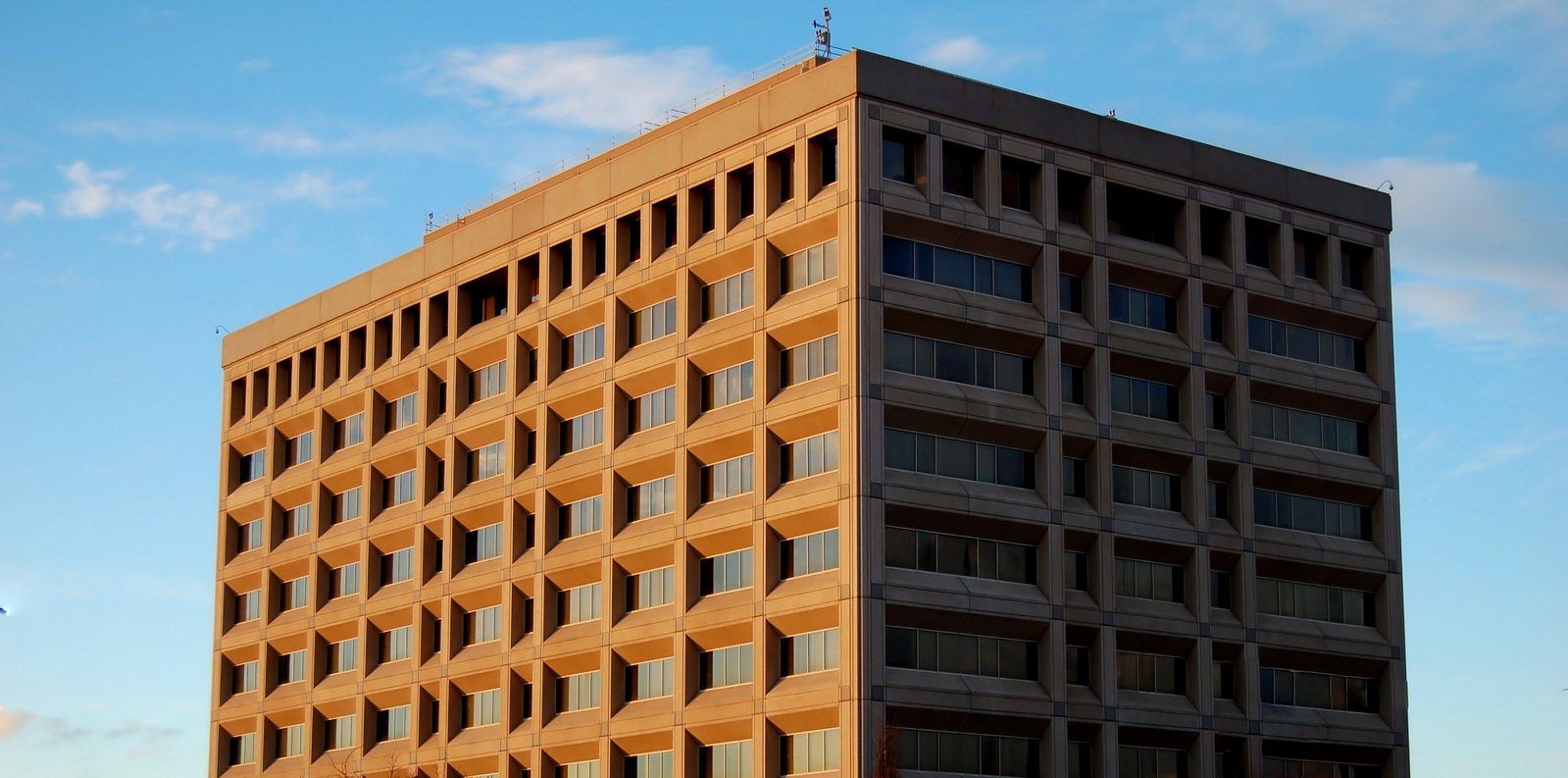 the top of a tall brick building on a clear day