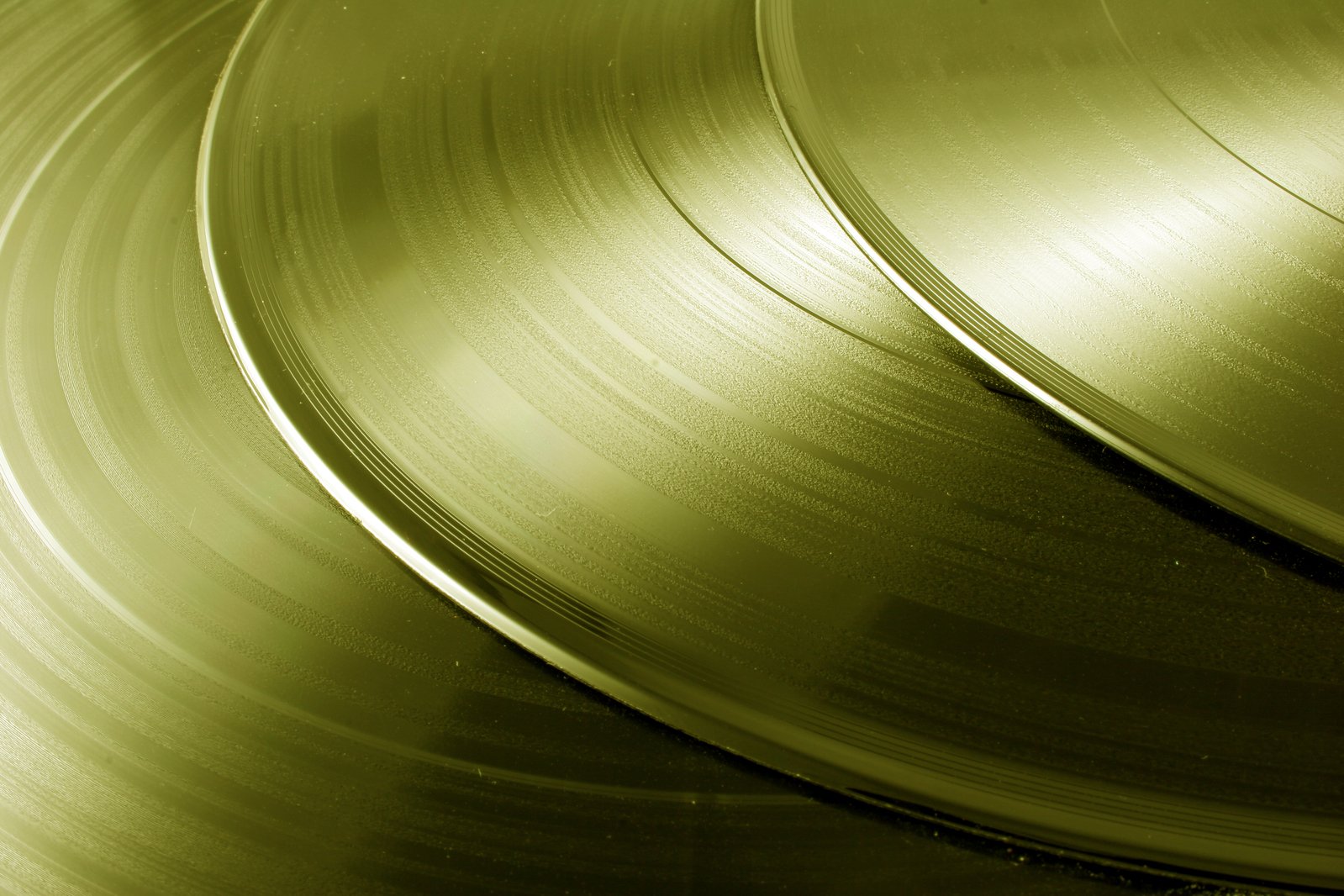 a stack of shiny metallic discs on a white background