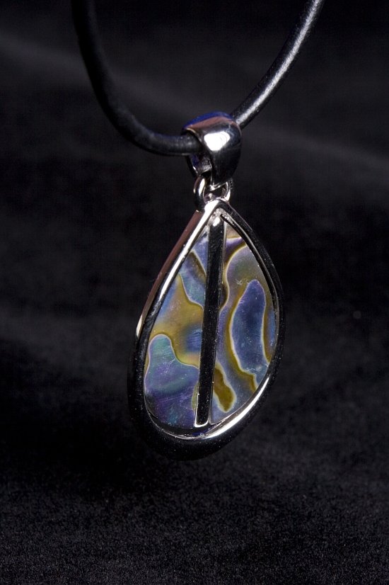 this pendant features a silver metal tear and a multi - colored pattern