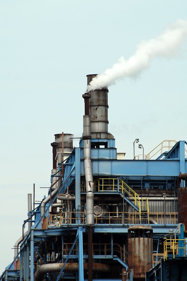 smoke coming from stacks coming out of large pipes