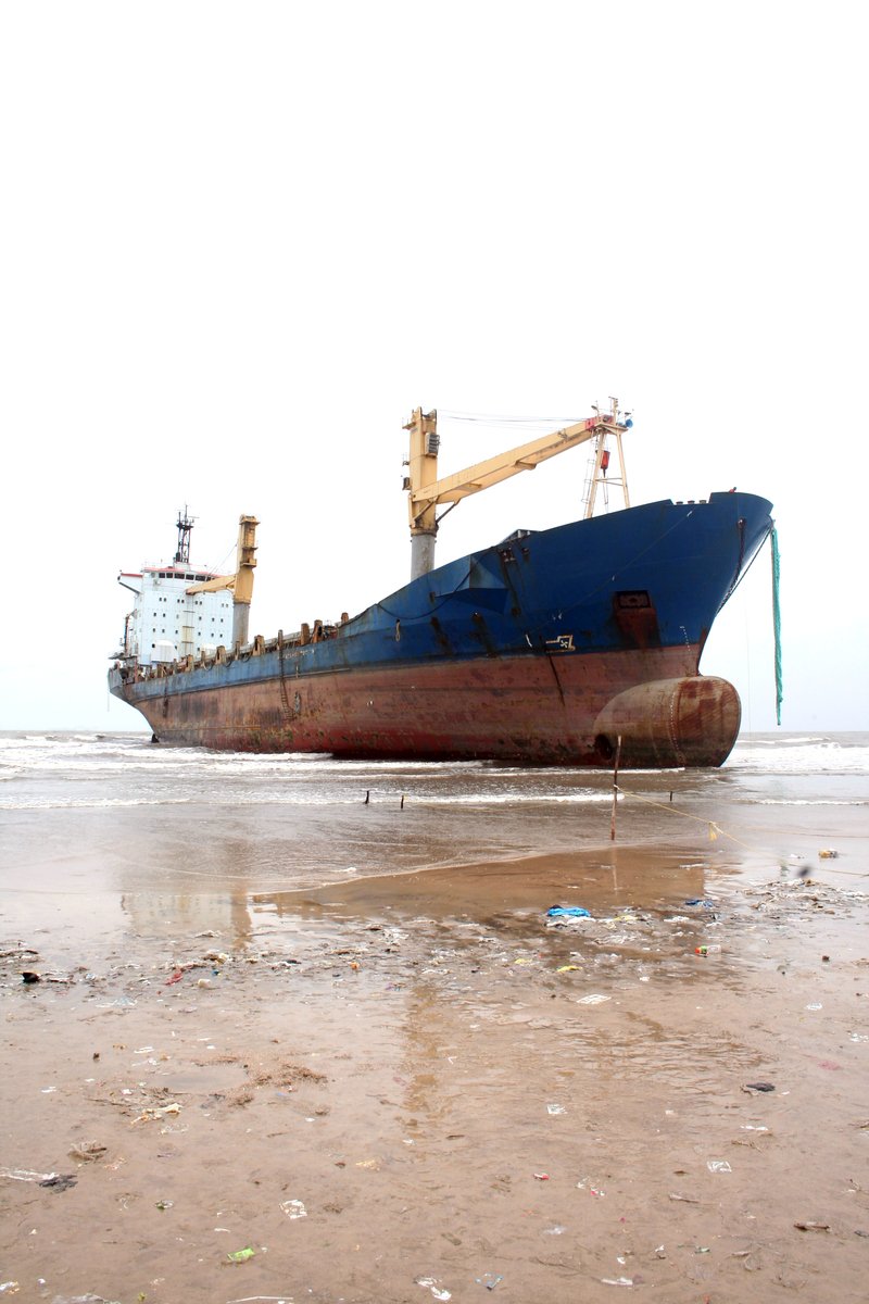 a very big ship by some water and some land