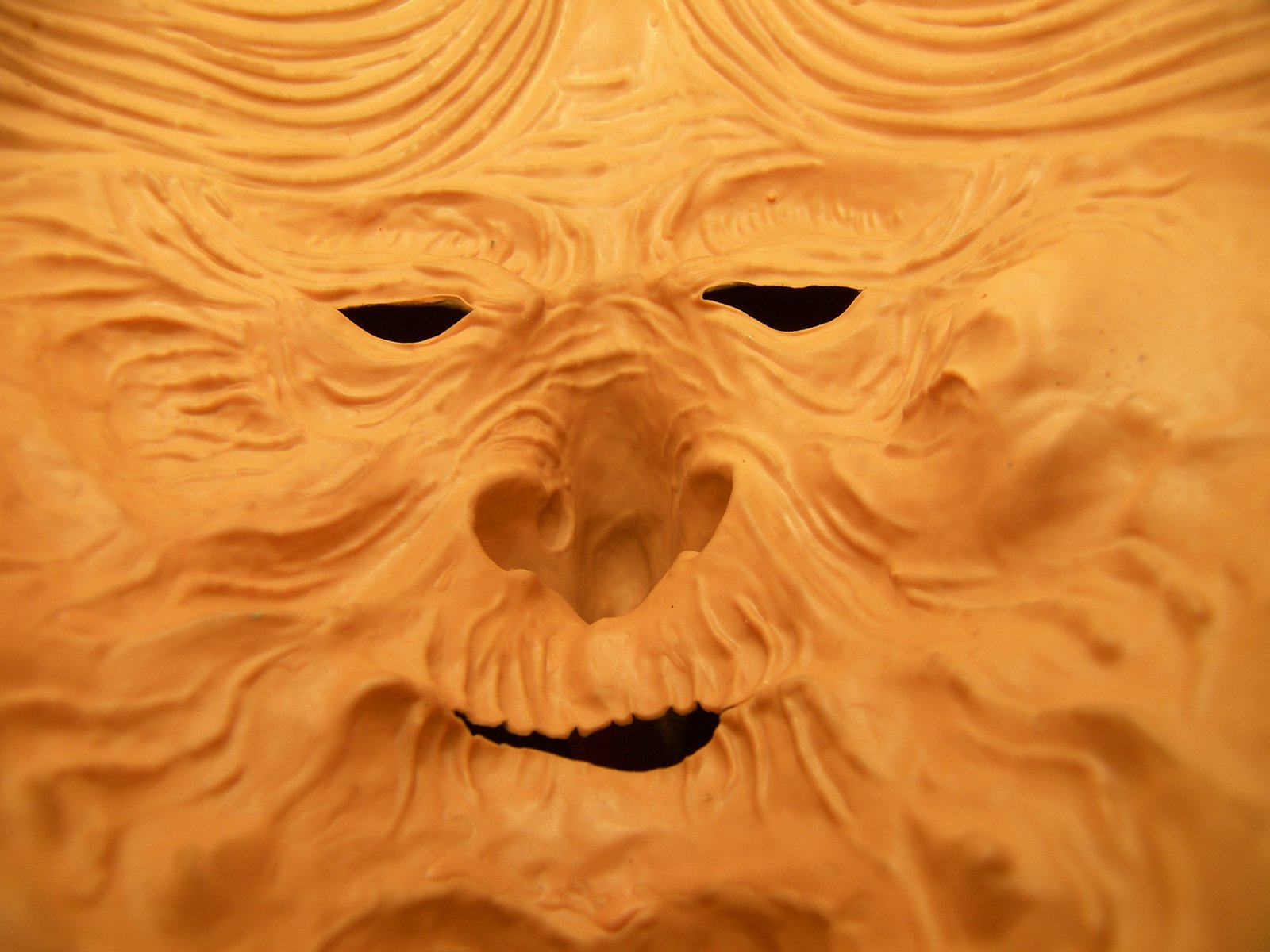 an elaborately carved pumpkin carving of a man's face