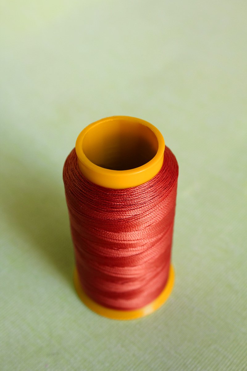 spool of thread sitting on top of a table