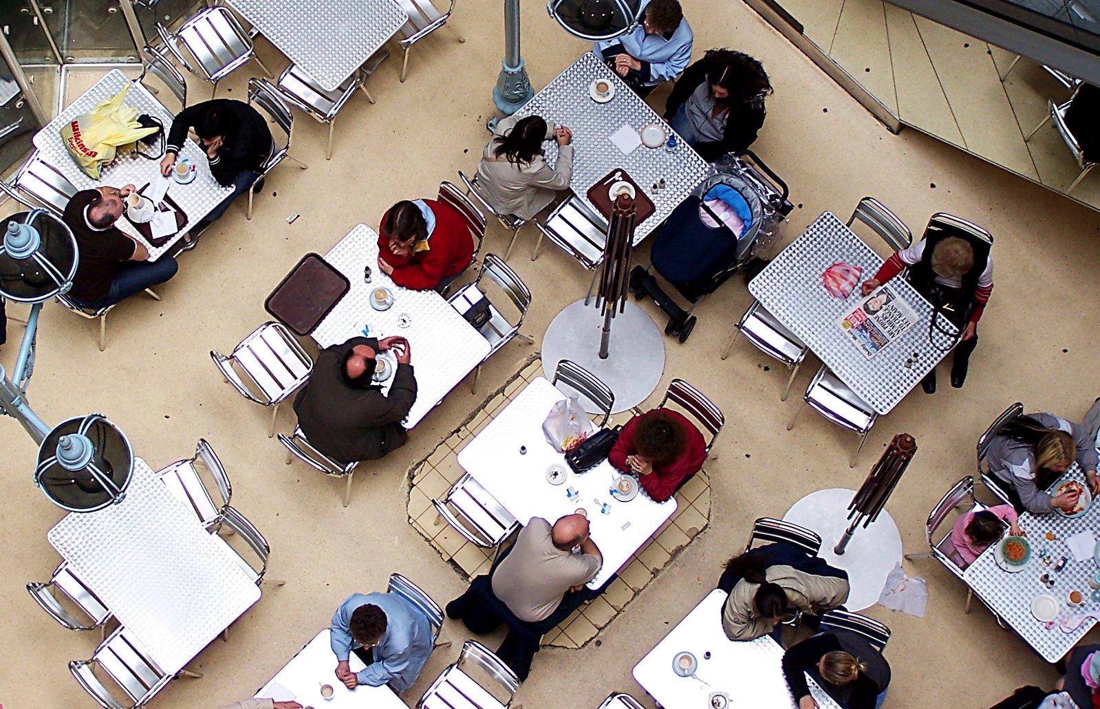 the aerial view of a group of people eating outside