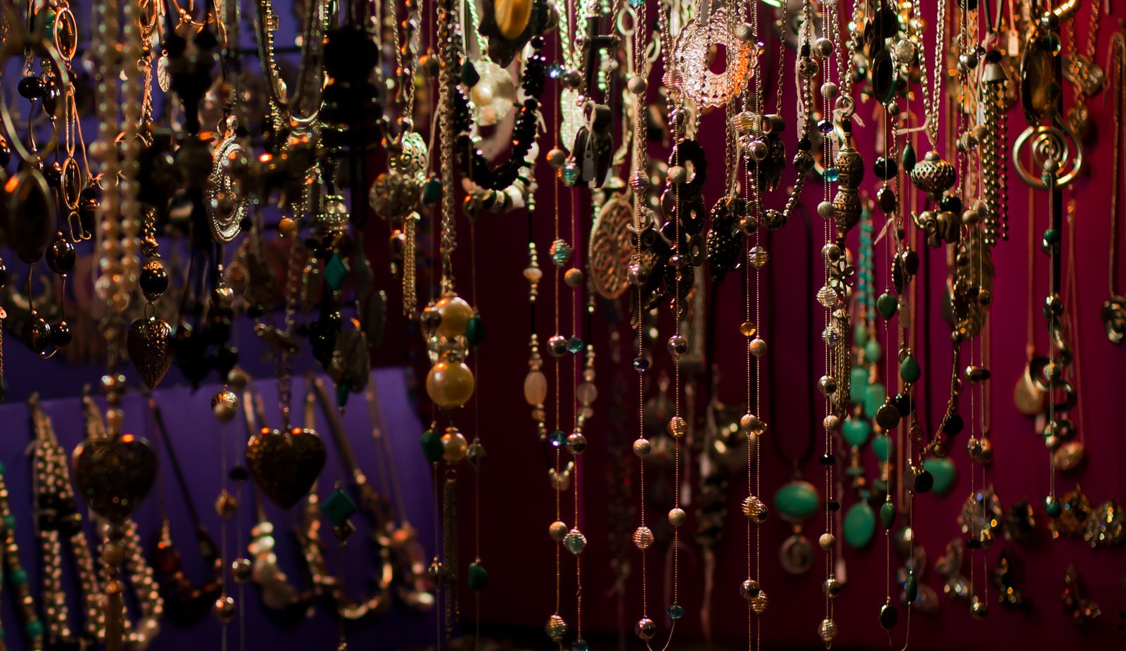 large amount of necklaces on display at the store