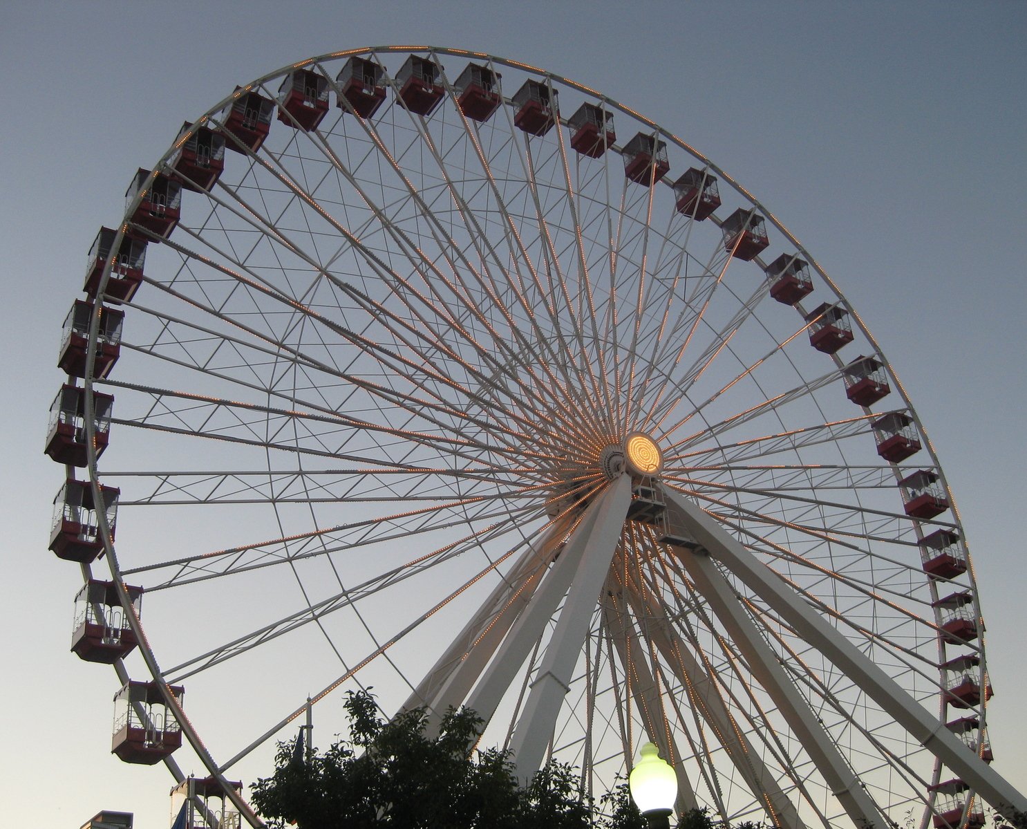 the ferris wheel with many people sitting on it