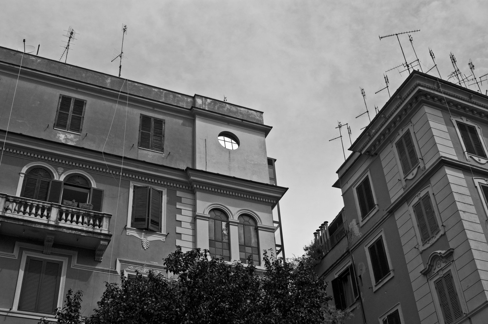 black and white po of two buildings with clock