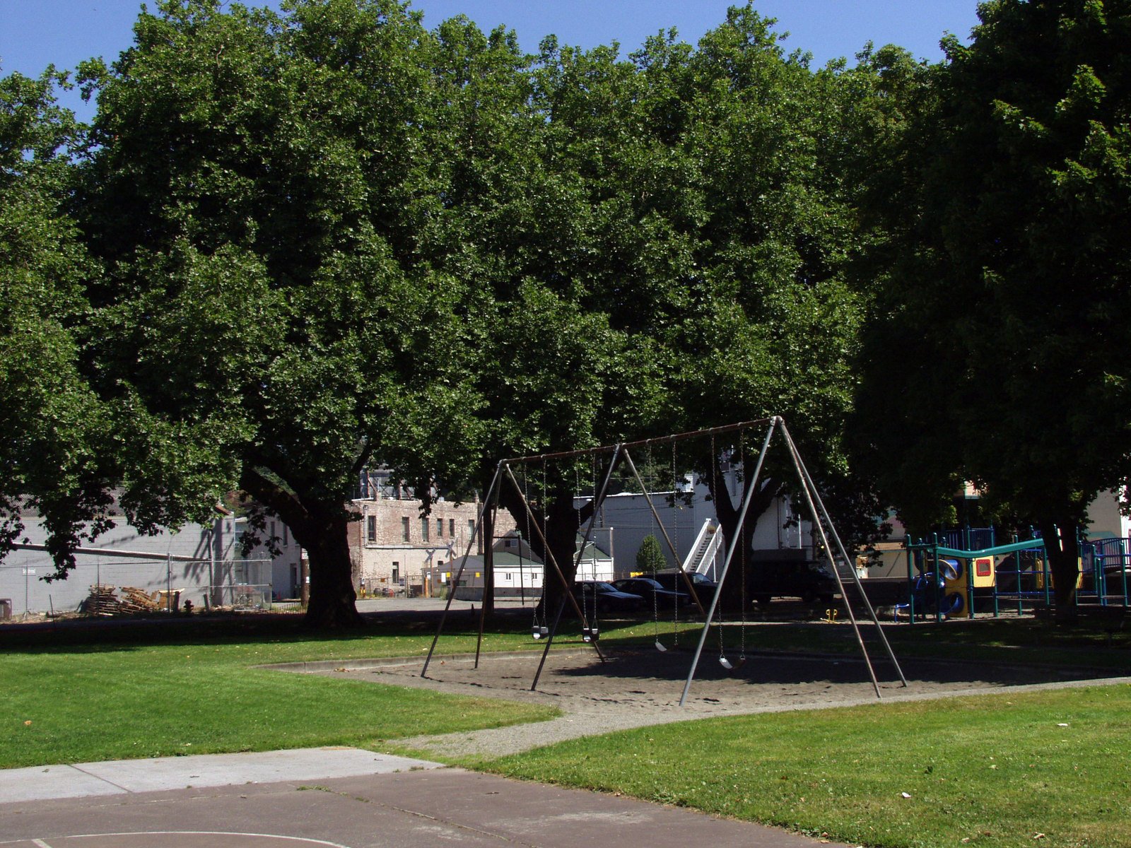 this is a playground with a swing set in it