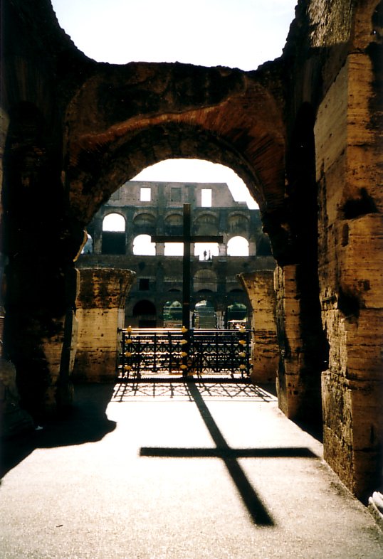 an open archway leads to tables in the background