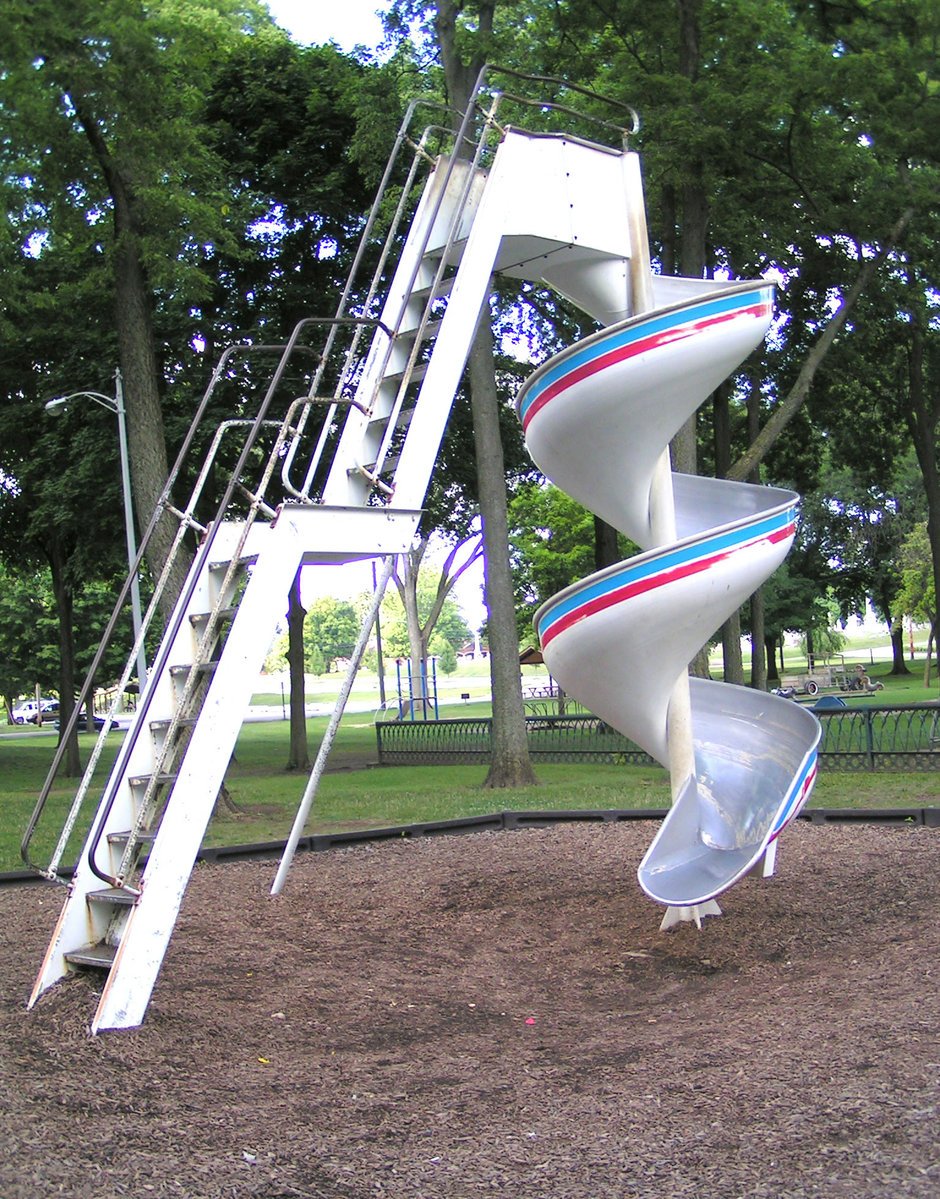 the modern playground equipment is in a park