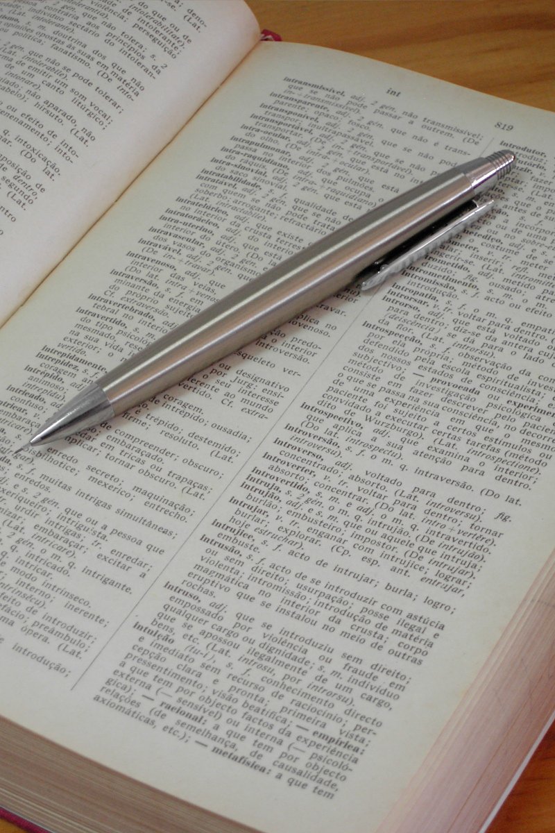 the fountain pen is sitting on top of a book