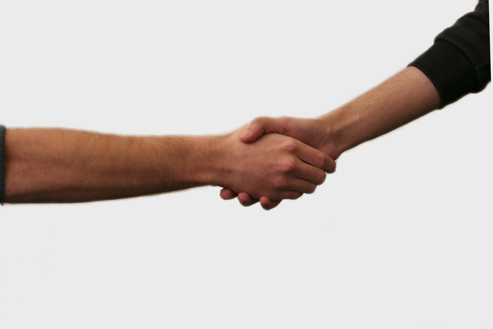 two people holding hands on a white background