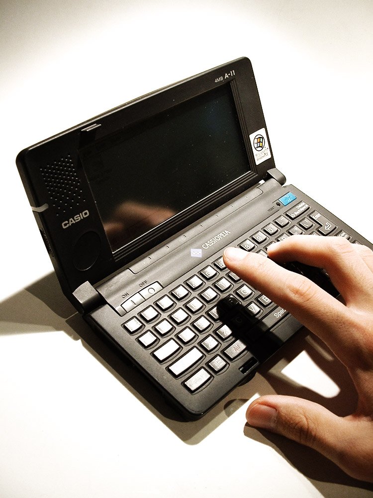 a person touching the keyboard of a laptop