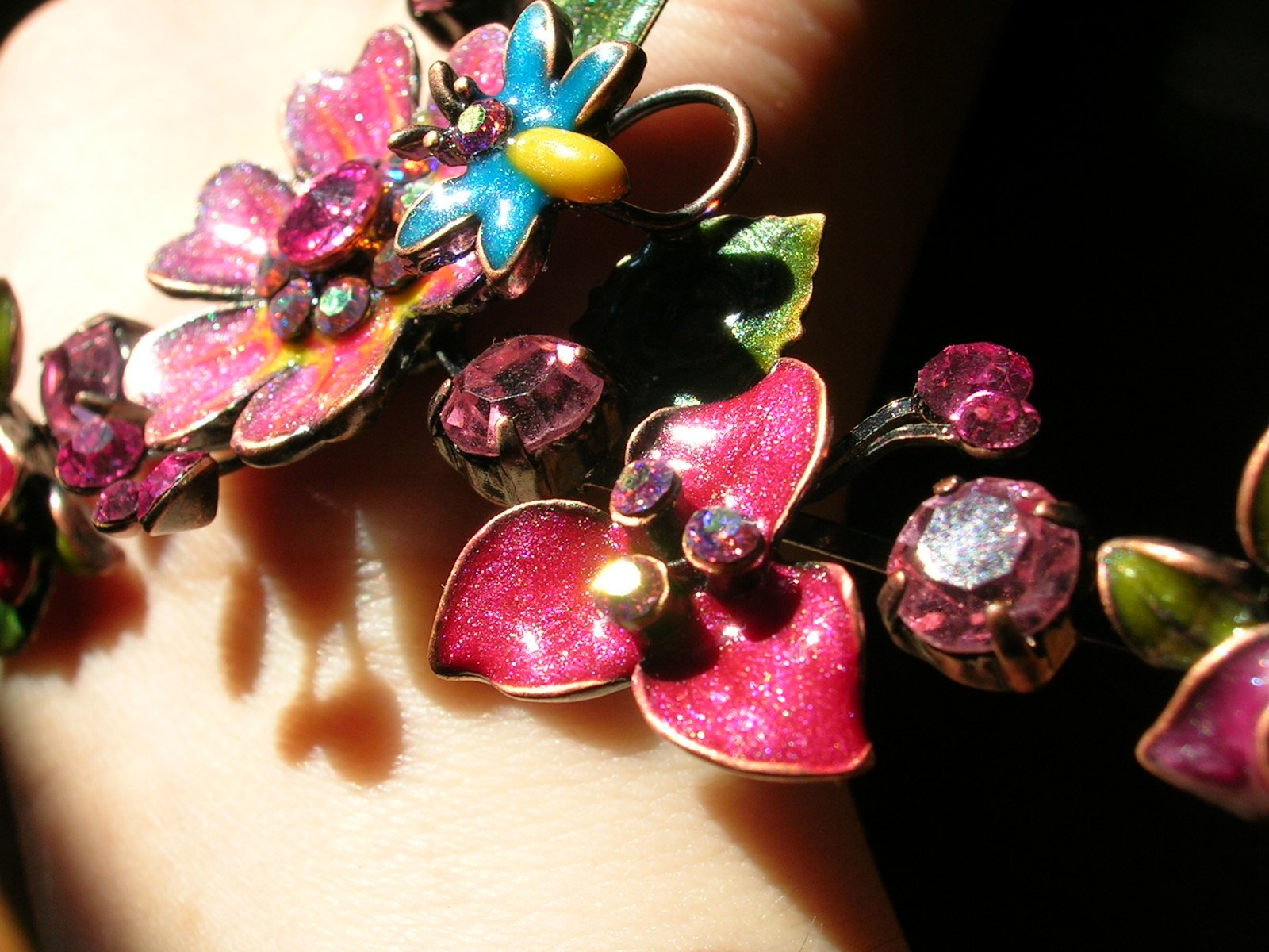 a person with a flower ring is wearing a flower ring