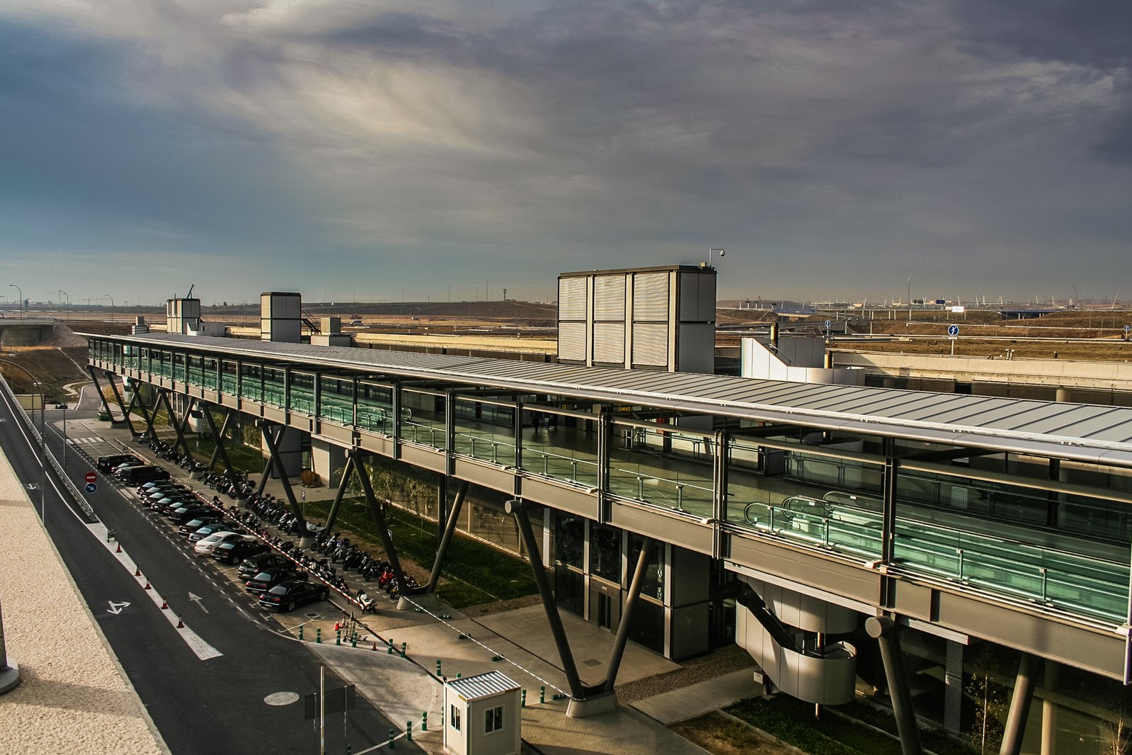 an airport with cars lined up all around