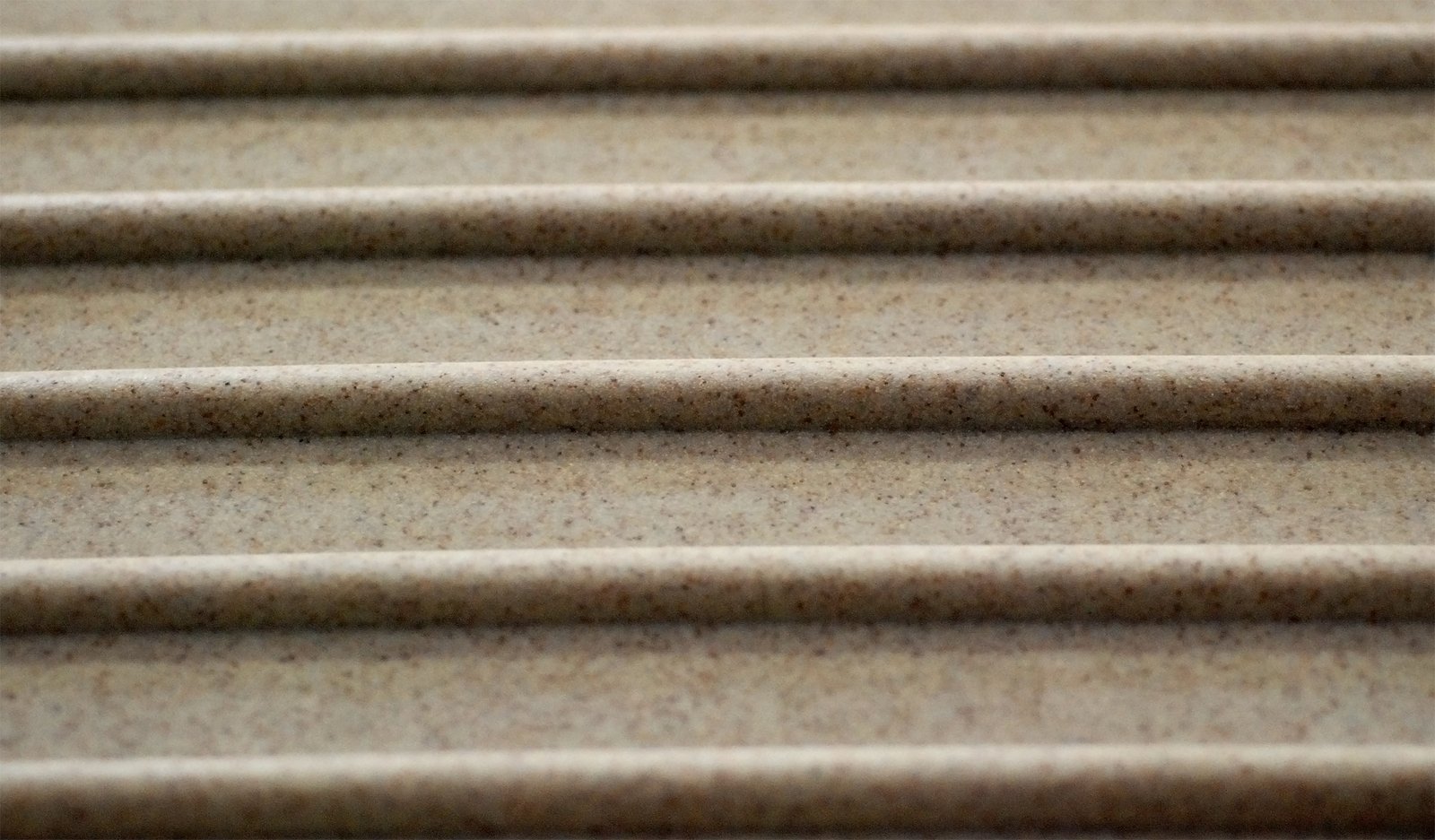 close up image of tan concrete slats