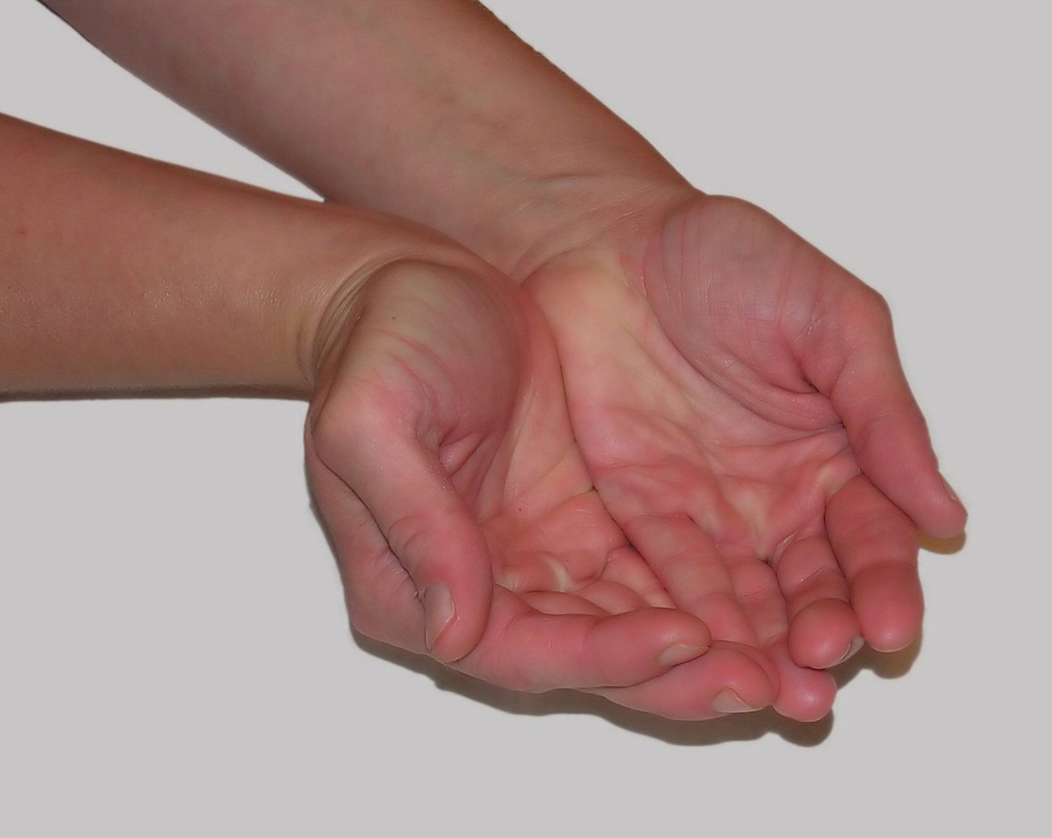 a hand extending with the palm outstretched